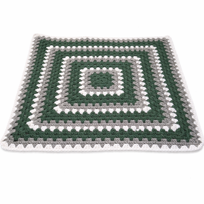 Handmade crochet green dinosaur blanket styled display | Unique Treasures